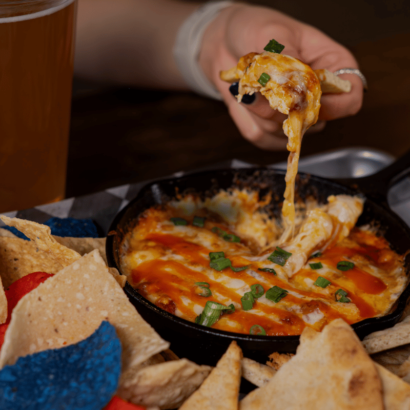 Buffalo_chicken_dip_with_chips_and_beer_(1).png