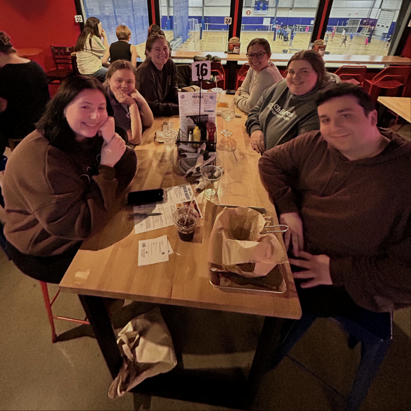 group_of_young_adults_playing_trivia_at_a_bar_(3).png